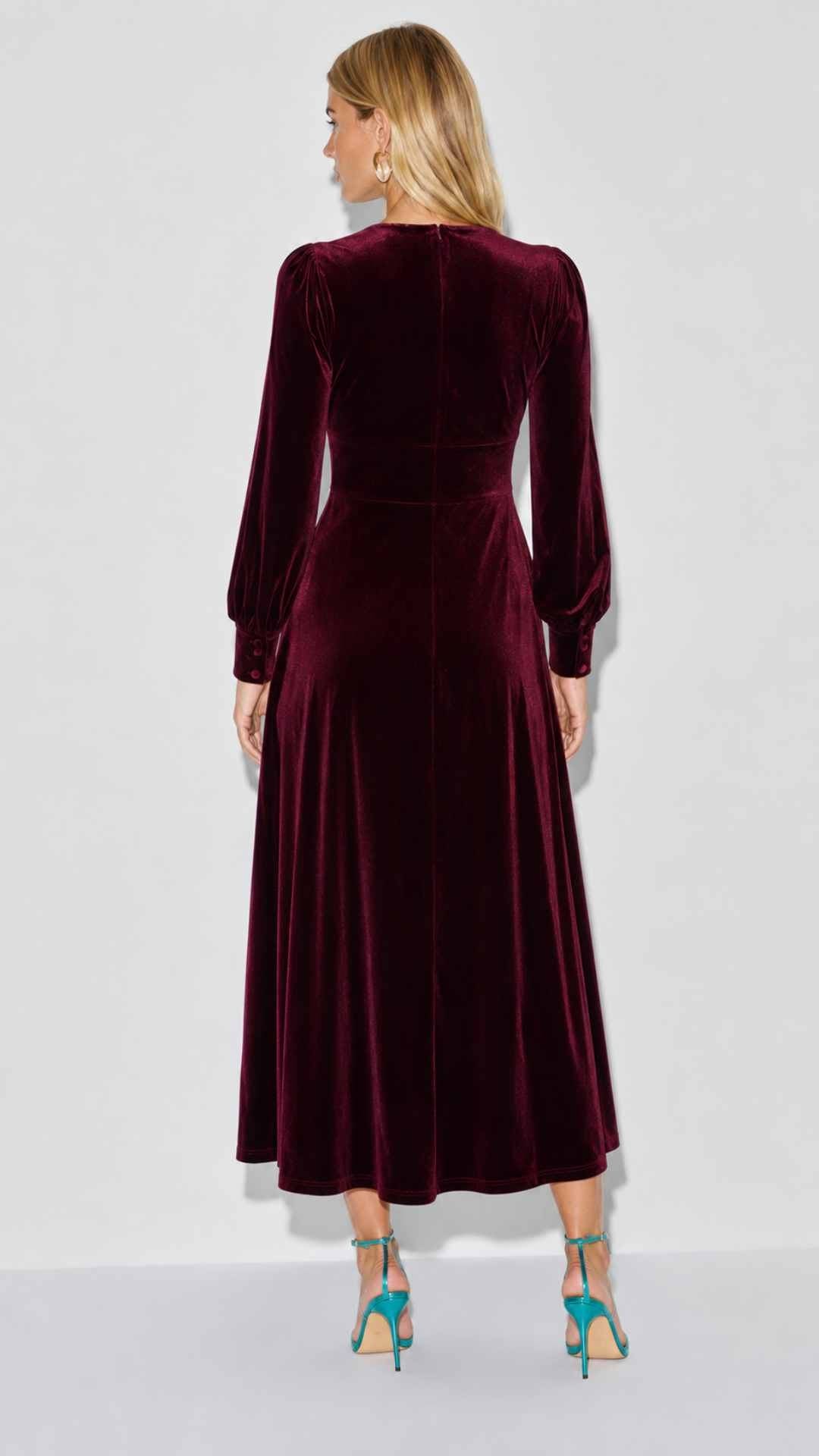 long sleeve velvet midi dress Petal and Pup Women's Darby Velvet Burnout Body is lined Smocking around neckline Buttons at front body Long sleeve with cuff Midi length with slight hi/lo hem (47 HPS at front/50 HPS at back) Balia Velvet Burgundy Midi Dress
